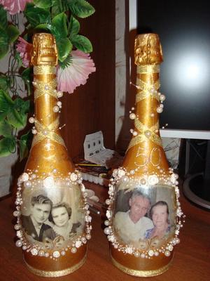 Бутылки шампанского на золотую свадьбу